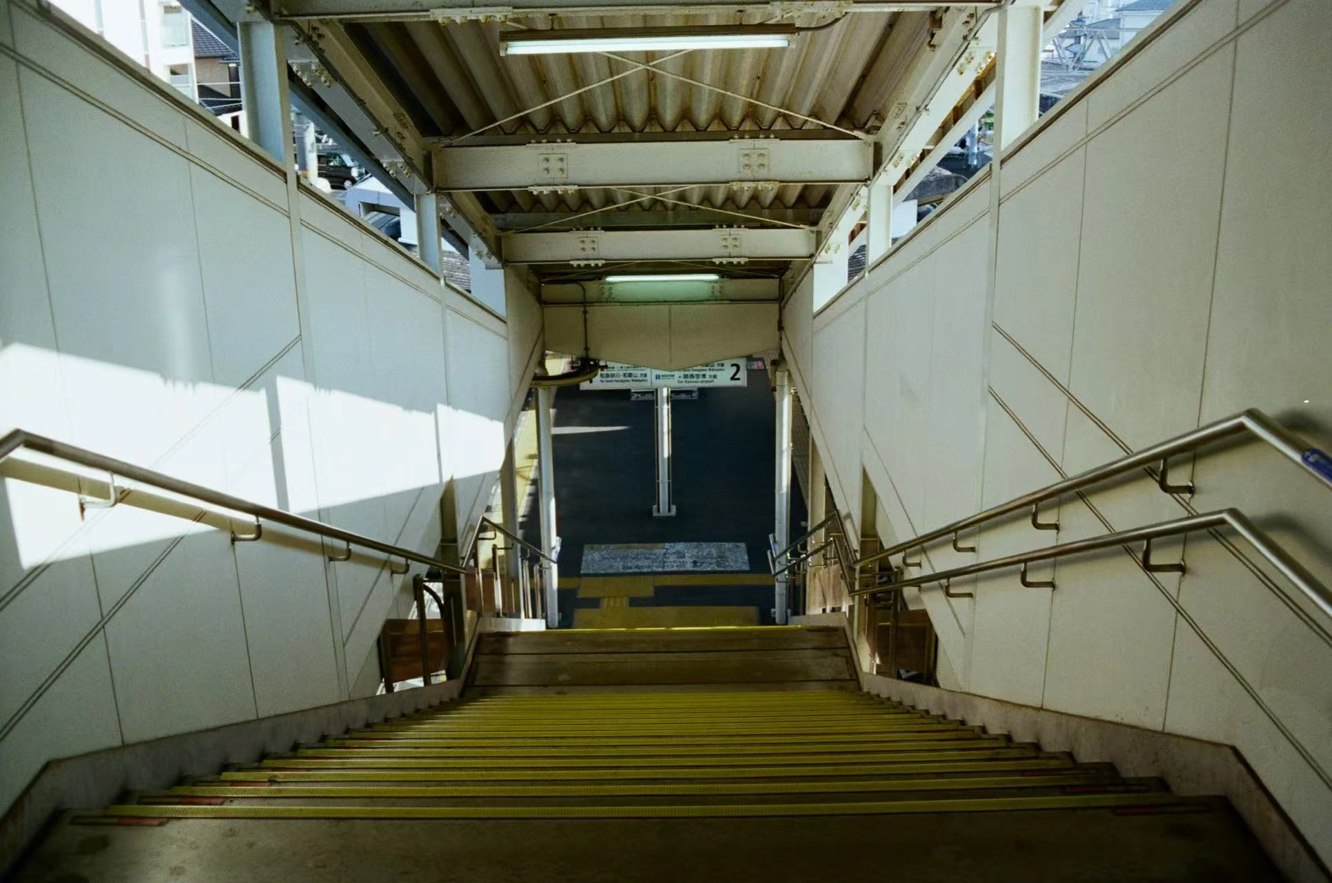 Light and shadow on a station stairway.